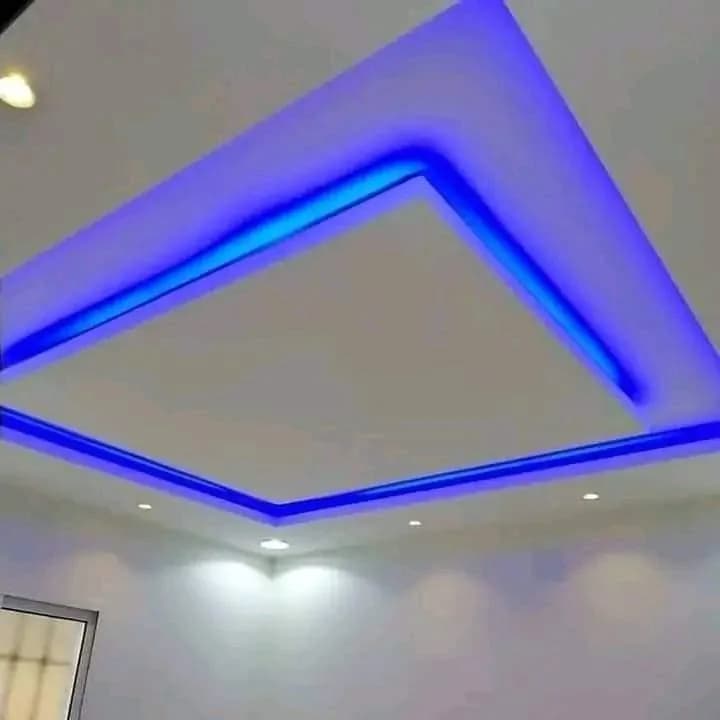 Layered bulkhead ceiling lit with blue LED strip lighting