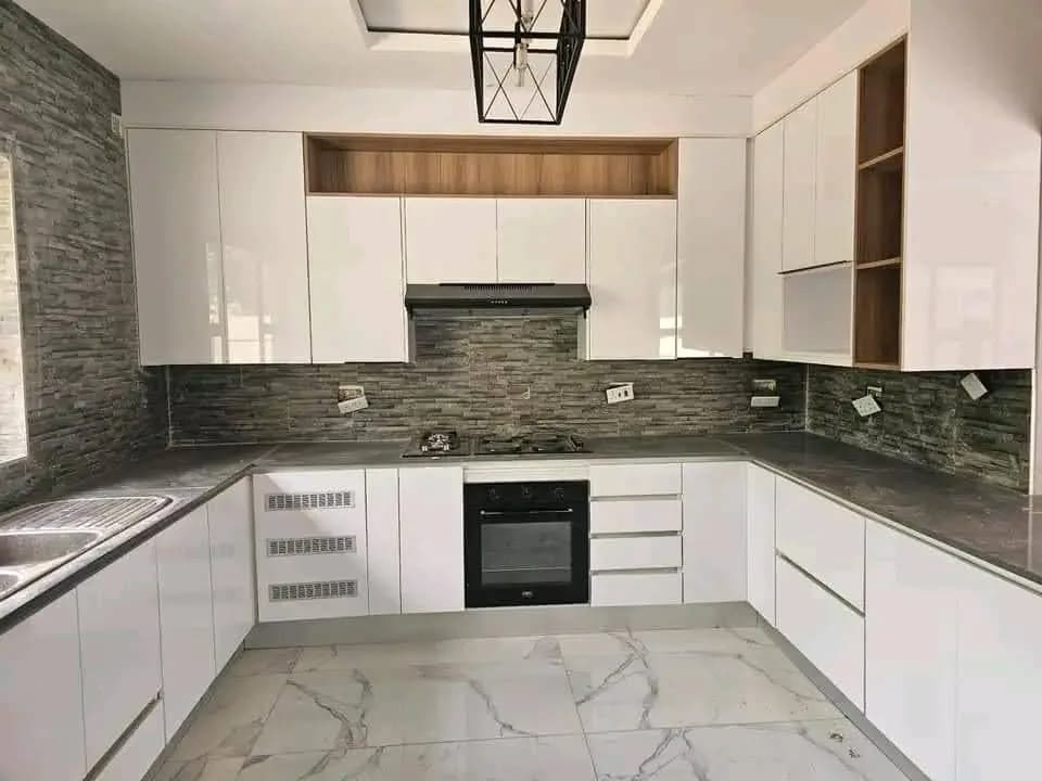 White gloss U-shaped kitchen with timber open shelving and marble-effect floor